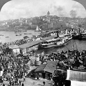 TURKEY: ISTANBUL, c1913. Crowds of pedestrians crossing the Galata Bridge over