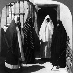 TURKISH HAREM, c1909. Veiled women leaving the harem at Adana, Asiatic Turkey, c1909