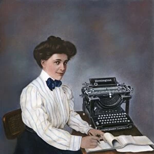 TYPIST, 1905. Secretary with Remington typewriter and her stenographers pad, 1905
