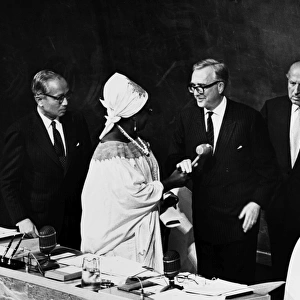 U. N. GENERAL ASSEMBLY, 1970. Temporary United Nations President Angie Brooks of Liberia hands the gavel to newly elected President Edvard Hambro of Norway at the opening of the 25th regular session on 15 September 1970. At left is Secretary General U Thant and at right is Under-Secretary General Constantine Stavropoulos