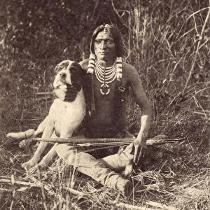UTE MAN WITH DOG, c1874. A young Ute man with his dog, in Utah. Photograph by John K. Hillers, c1874