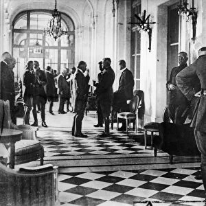 VERSAILLES TREATY, 1919. Delegates waiting in a hallway in the Palace of Versailles in France