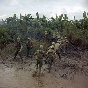 VIETNAM WAR, 1967. Troops of the Mobile Riverine Force arriving on land for an assault mission