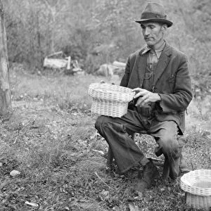 VIRGINIA: BASKET WEAVER. John Nicholson with some of the baskets that he weaves