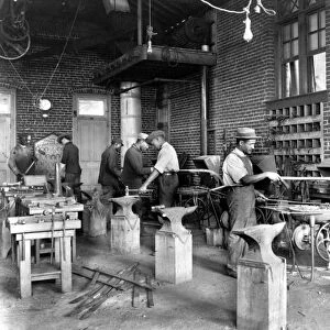 VIRGINIA: BLACKSMITH. Young men training in blacksmithing at Hampton Institute, Hampton, Virginia
