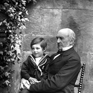 WILLIAM EWART GLADSTONE (1809-1898). English statesman. Photographed with his grandson