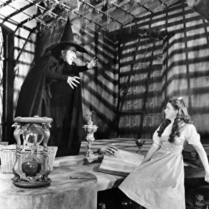 WIZARD OF OZ, 1939. Margaret Hamilton as the Wicked Witch of the West and Judy Garland as Dorothy