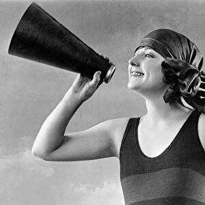 WOMAN, c1920. A woman holding a megaphone. Photograph, c1920