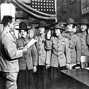 WOMEN MARINES, 1918. Women being sworn in to the United States Marine Corps, where