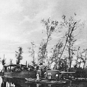 WORLD WAR I: ARMED BARGE. A French barge armed with cannons to deter German advances