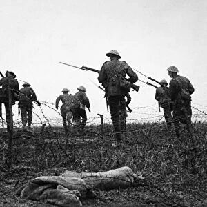 WORLD WAR I: BARBED WIRE. Allied troops advancing through barbed wire during the