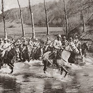 WORLD WAR I: CAVALRY. French cavalrymen wading their horses through a stream in