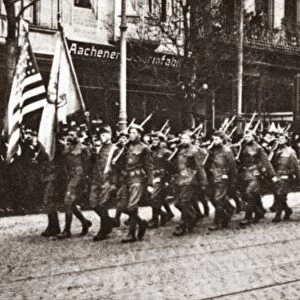 WORLD WAR I: OCCUPATION. The American Army marching through Aachen (Aix-La-Chapelle)