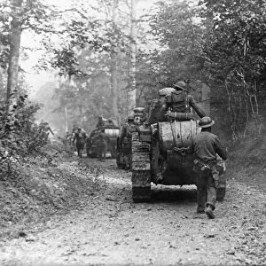 WORLD WAR I: TANK, c1917. Armored column advances down a forest road. Photograph
