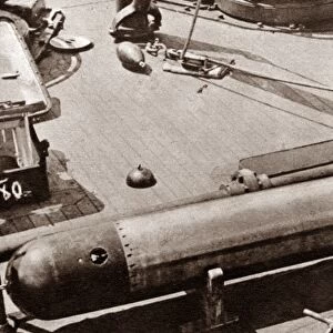 WORLD WAR I: TORPEDO. 21-inch torpedo being loaded onto the U