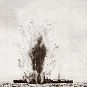 WORLD WAR I: TORPEDO. A merchant ship struck and blown up by a torpedo fired