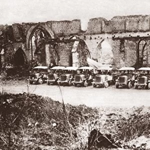 WORLD WAR I: VARENNES. Motor transports outside the ruins of a cathedral at Varennes