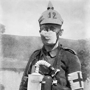 WWI: GERMAN SOLDIER, c1914. A German medic wearing a face mask to protect against gas attacks