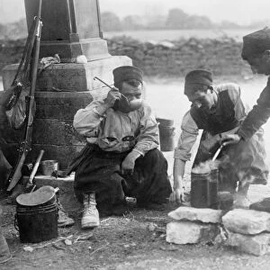 WWI: ZOUAVES, c1914. French Zouaves drinking with ladles. Photograph, c1914