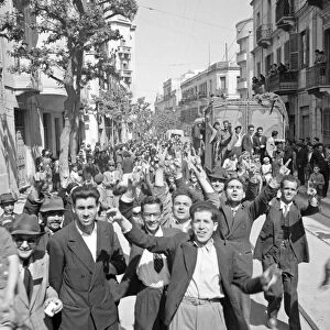 WWII: TUNISIA, 1943. A cheering crowd in Tunis, Tunisia. Photograph by Nick Parrino