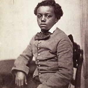 YOUNG BLACK BOY, c1860. American studio portrait of an unidentified young boy, c1860