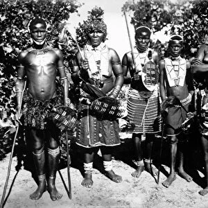 ZULU WARRIORS. Zulu warriors wearing traditional attire, South Africa. Photograph