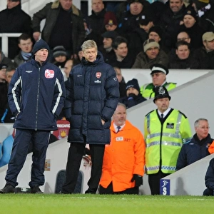 Arsenal manager Arsene Wenger with Fourth Official Peter Walton. West Ham United 1