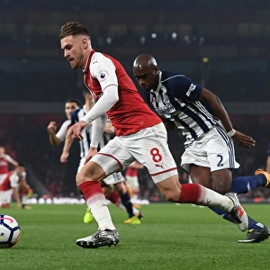 Arsenal's Aaron Ramsey Outmaneuvers West Brom's Allan Nyom in Premier League Clash
