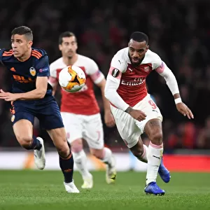 Arsenal's Alex Lacazette Battles Past Valencia's Gabriel in UEFA Europa League Semi-Final Showdown