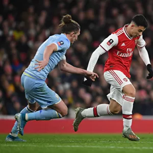 Arsenal's Gabriel Martinelli Clashes with Leeds Luke Ayling in FA Cup Showdown
