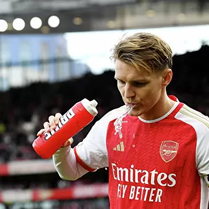 Arsenal's Martin Odegaard Sips Prime Beverage Before Arsenal vs Brighton & Hove Albion (2023-24)