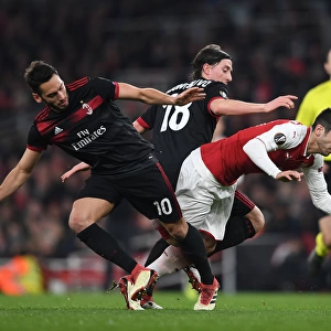 Arsenal's Mkhitaryan Clashes with Calhanoglu and Montolivo in Europa League Showdown
