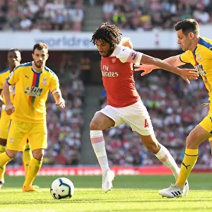 Arsenal's Mohamed Elneny Clashes with Crystal Palace's Scott Dann in Premier League Showdown