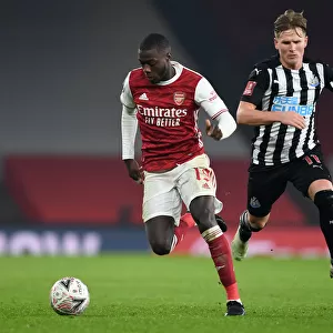 Arsenal's Nicolas Pepe Clashes with Newcastle's Matt Ritchie in FA Cup Third Round