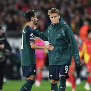 Arsenal's Vieira and Odegaard Celebrate after RC Lens Victory in 2023-24 UEFA Champions League