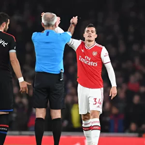 Arsenal's Xhaka Clashes with Referee during Intense Arsenal vs. Crystal Palace Match
