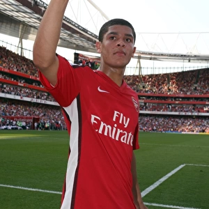 Denilson (Arsenal) waves to the fans after the match
