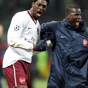 Emmanuel Adebayor celebrates at the final whistle with Emmanuel Eboue (Arsenal)