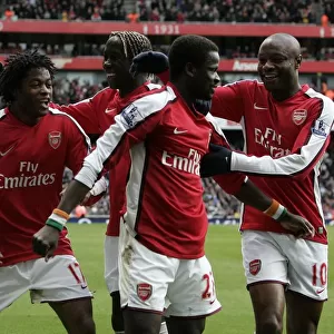 Triumphant Moment: Arsenal's Eboue, Gallas, and Song Celebrate 3rd Goal vs. Burnley in FA Cup