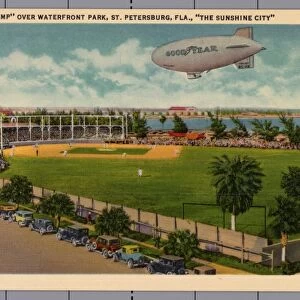 Blimp over Waterfront Park. ca. 1933, St. Petersburg, Florida, USA, THE BLIMP OVER WATERFRONT PARK, ST. PETERSBURG, FLA. THE SUNSHINE CITY. THE BASEBALL FIELD. One of St. Petersburgs many sport attractions, located in Waterfront Park on Tampa Bay
