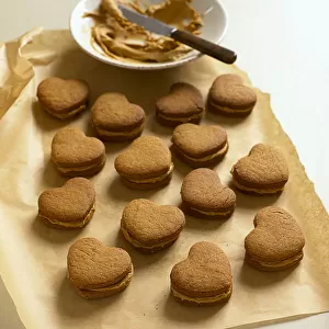 Coffee flavoured, heart shaped biscuits with cream filling