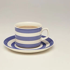 Cup and saucer filled with tea