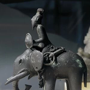 Egypt, Sculpture representing a soldier riding an elephant, bronze