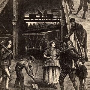 Pithead scene showing men and boys coming up from an underground shift. Note the female