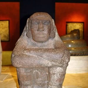 Seated stone figure of Xochipilli the Aztec god of music and dance. Mexico, AD 1325-1521