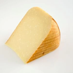 Slice of American Mona ewe and cows milk cheese