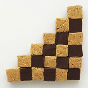 Square blocks of peanut butter sweets arranged in chessboard pattern