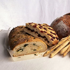 Stuffed herb bread, sweet fruit bread, hard crust loaf, breadsticks and ciabatta