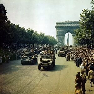 World War II 1939-1945: Crowds lining the Champs Elysees to view Allied tanks