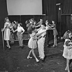 Young child actors in Hollywood learning folk dancing at their school